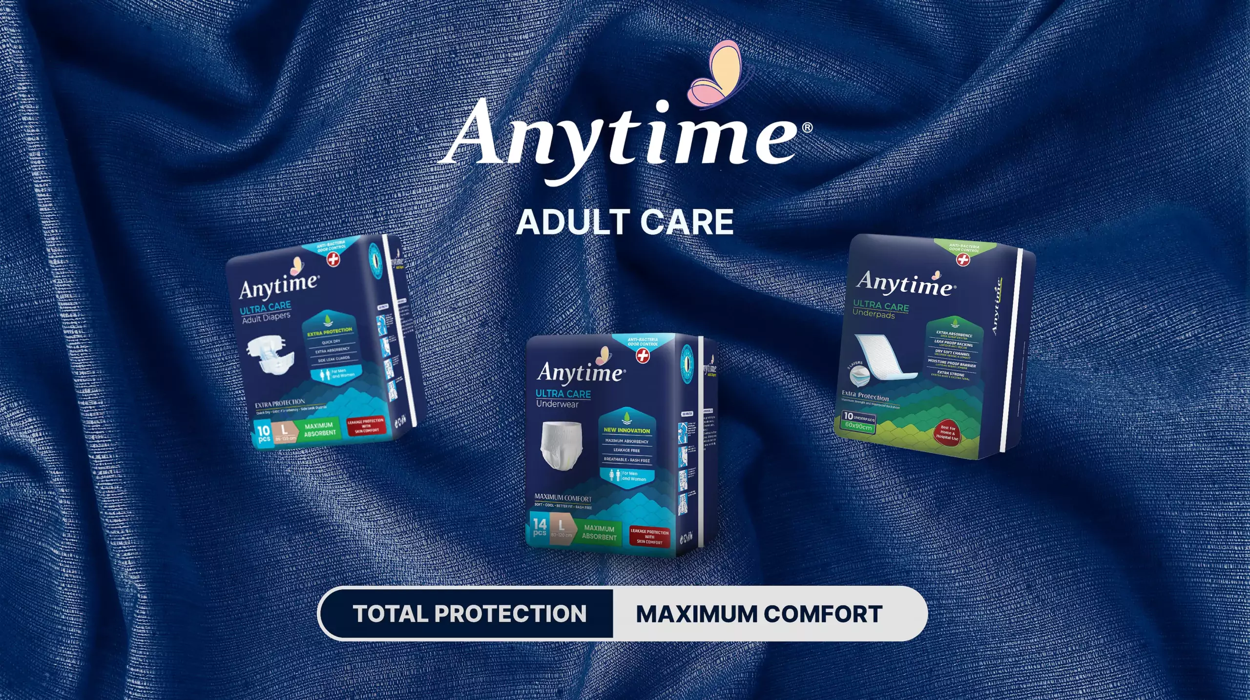 a_main_banner_image_as_the_home_page_opener,_ which_includes_anytime_adult_care_products_including_adhesive_adult diapers_adult_diaper_pants_and_underpads_or_absorbent_pads._Equipped_with_the_slogan_Total_Protection_Maximum_Comfort